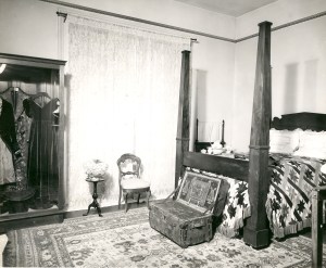 hc-bedroom-with-clothes-on-display-crop